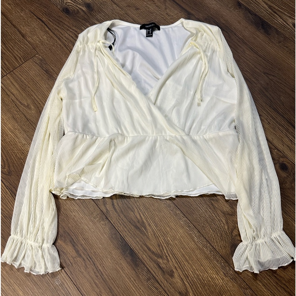 Crème and white color long sleeve blouse with ruffle material